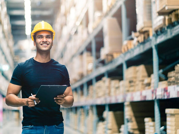 Warehouse worker checking inventory representing quality control